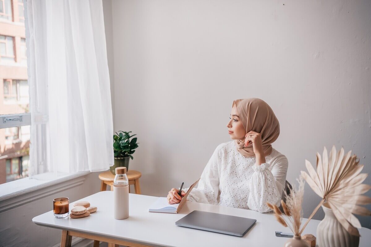 Confident woman taking notes about CMI Level 3